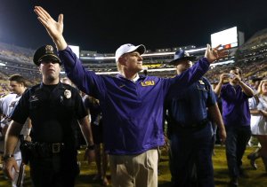 Les Miles receives the crowd's blessing after the game.